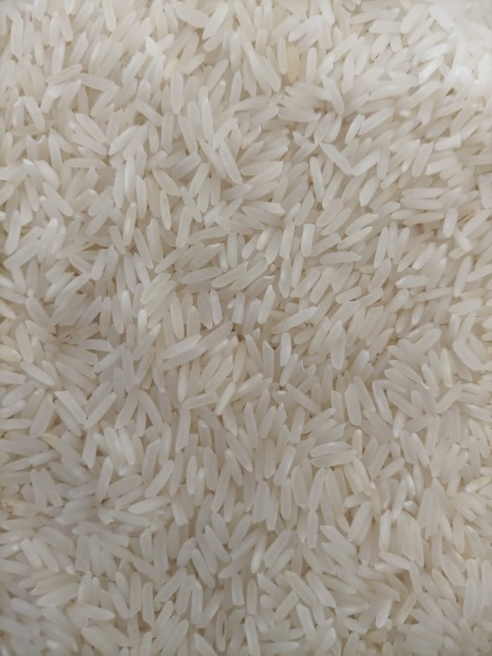 Mastering the First Impression: Your intriguing post title goes here Detailed photo of uncooked white rice grains showcasing texture and abundance.